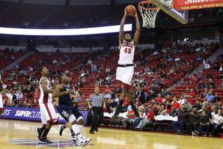 UNLV forward Mike Moser dunks the ball during the closing minute of their game against Washburn Tuesday, Nov. 1, 2011. UNLV won the exhibition game 58-50.